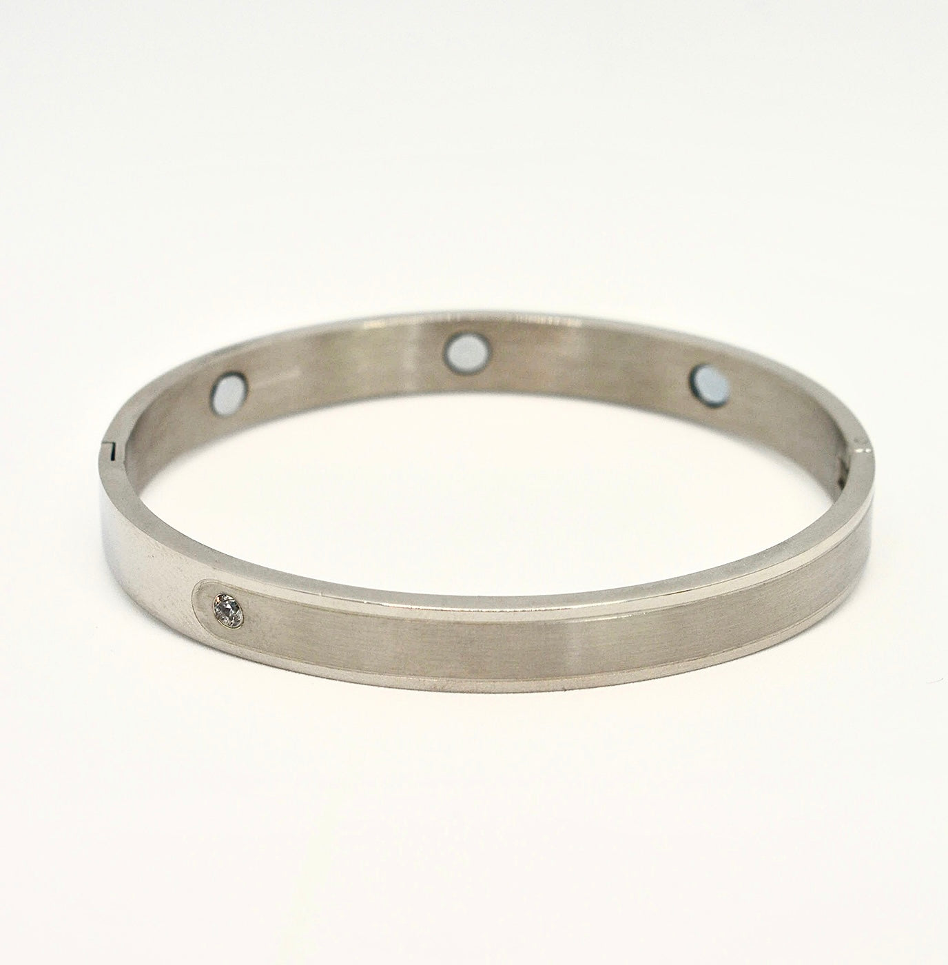 Magnetic two-tone polished and brushed silver bangle with crystal