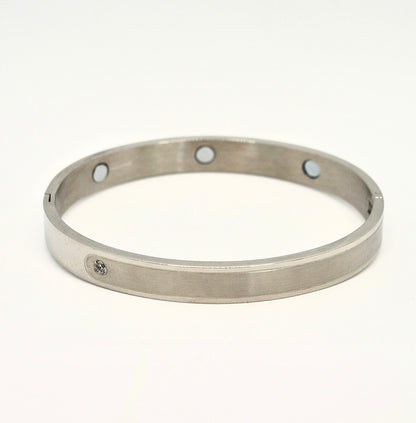 Magnetic two-tone polished and brushed silver bangle with crystal